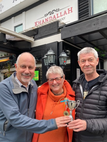 Kevin, Helen, Tim standing outside Khandallah Trading Company quiz venue and holding a trophy